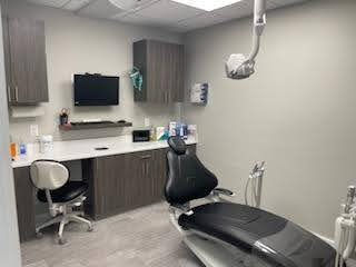 Dental treatment room with chair and equipment